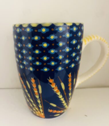 Blue Cup with Orange lines on the bottom  |  Potter's Workshop, South Africa
